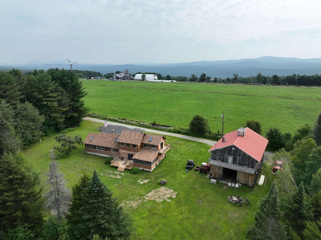 drone / aerial view with a mountain view and a rural view