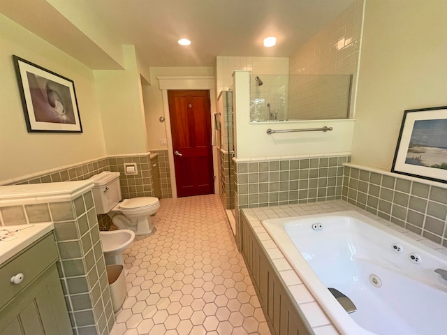 bathroom featuring tile patterned flooring, a bidet, and independent shower and bath