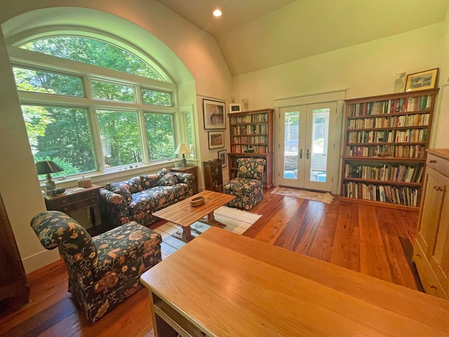 interior space featuring vaulted ceiling, dark hardwood / wood-style flooring, and french doors