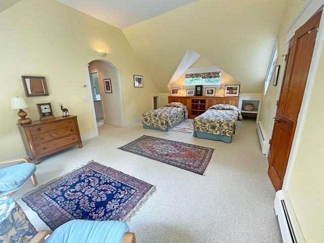 bedroom featuring light carpet, vaulted ceiling, and a baseboard heating unit