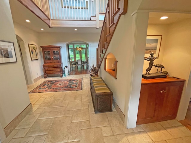 foyer entrance with a high ceiling