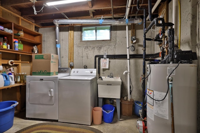 laundry area featuring water heater and washer and clothes dryer