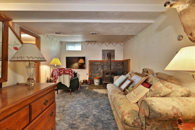 interior space with dark carpet and a wood stove