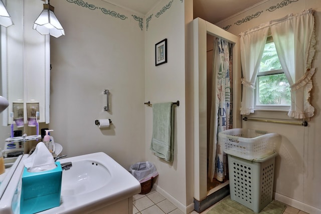 bathroom featuring tile patterned floors and sink