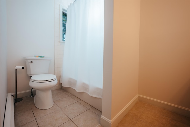 bathroom featuring a baseboard radiator, tile patterned flooring, toilet, and curtained shower