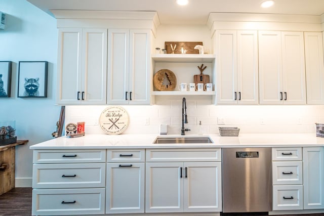 bar with a sink, decorative backsplash, stainless steel dishwasher, and recessed lighting