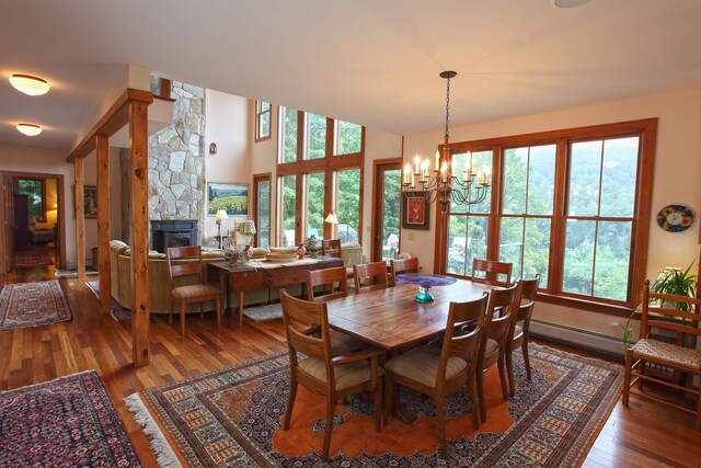 dining area with a baseboard radiator, plenty of natural light, and light hardwood / wood-style flooring