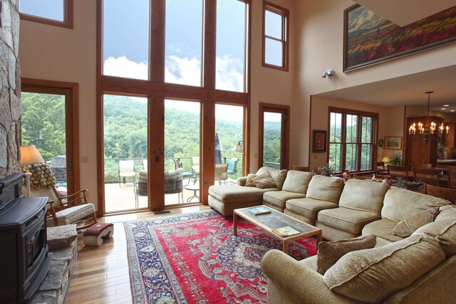 living room with a high ceiling and wood-type flooring