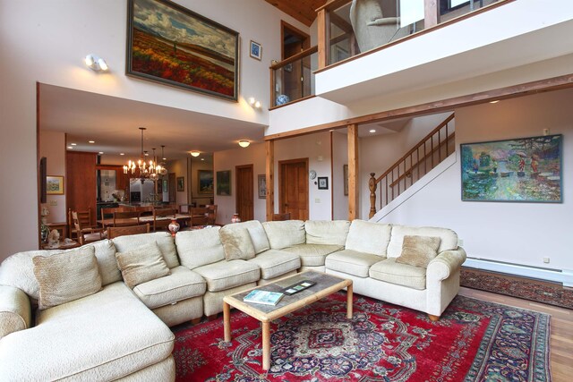 living room with hardwood / wood-style floors and a baseboard heating unit