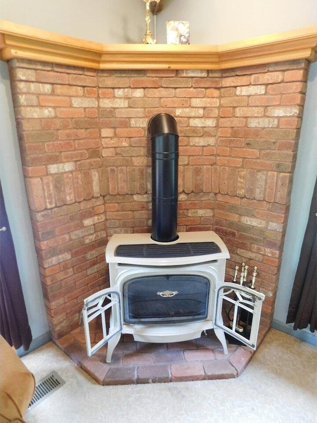 interior details featuring a wood stove