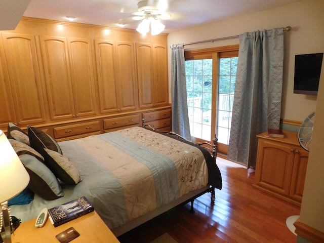 bedroom with hardwood / wood-style flooring and ceiling fan