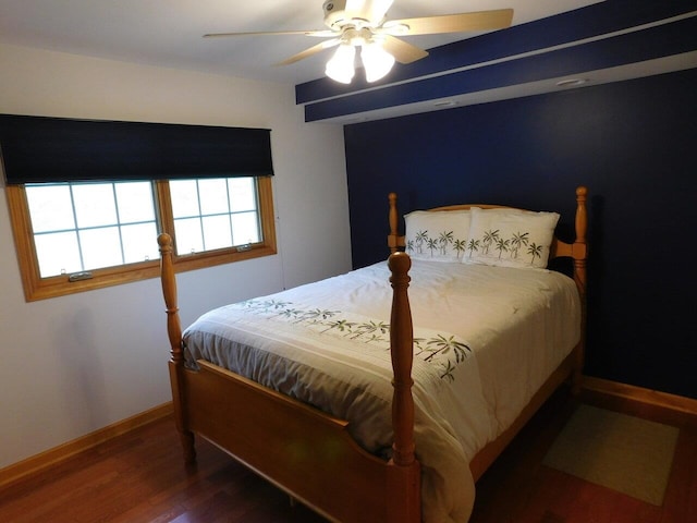 bedroom with hardwood / wood-style flooring and ceiling fan