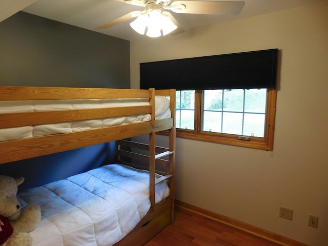 bedroom with hardwood / wood-style flooring and ceiling fan