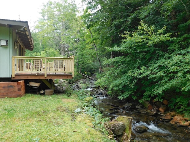 view of yard with a wooden deck