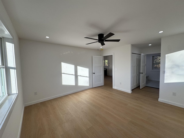 spare room with light wood finished floors, ceiling fan, baseboards, and recessed lighting