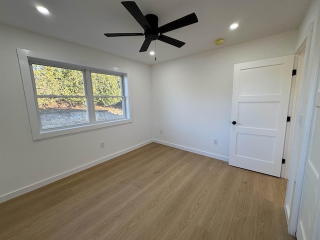 interior space with a ceiling fan, light wood-type flooring, baseboards, and recessed lighting