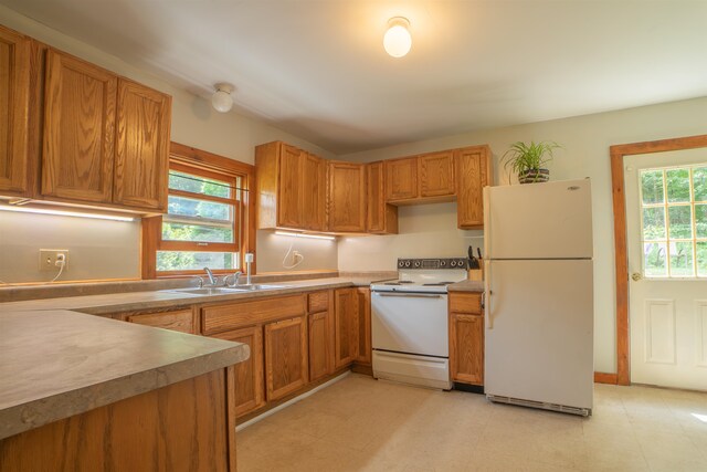 kitchen with sink and white appliances