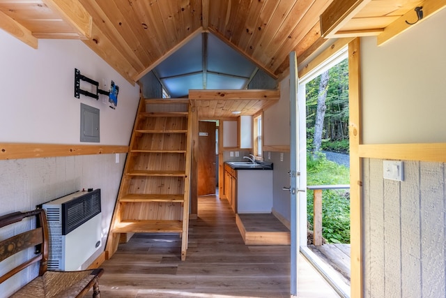 interior space with hardwood / wood-style flooring, sink, vaulted ceiling, electric panel, and wood ceiling