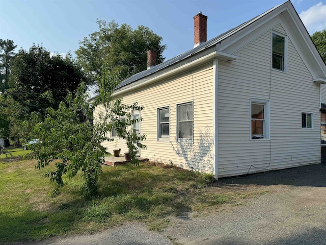 view of home's exterior featuring a chimney