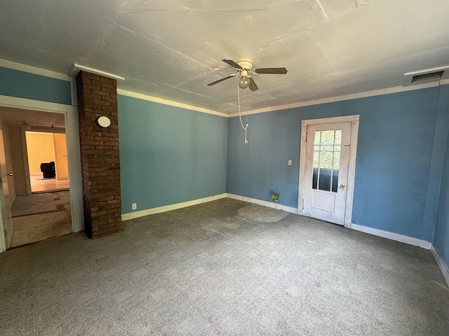 spare room featuring visible vents, baseboards, carpet flooring, and a ceiling fan