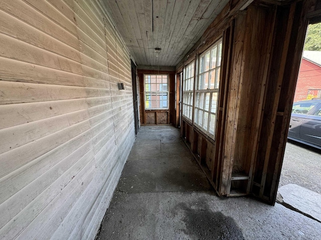 hall with plenty of natural light and wood ceiling