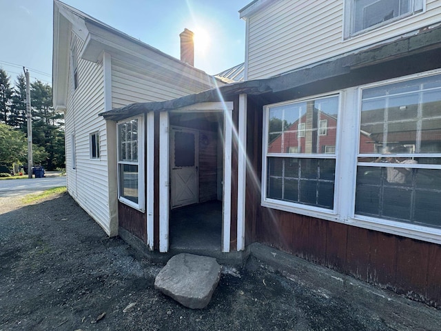 view of side of home with a chimney