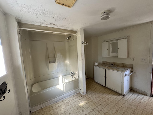 full bath with vanity, tile patterned floors, baseboards, and shower / washtub combination