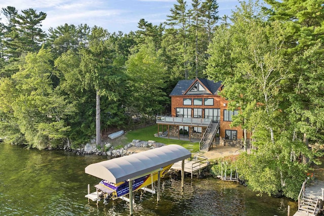 dock area featuring a deck with water view