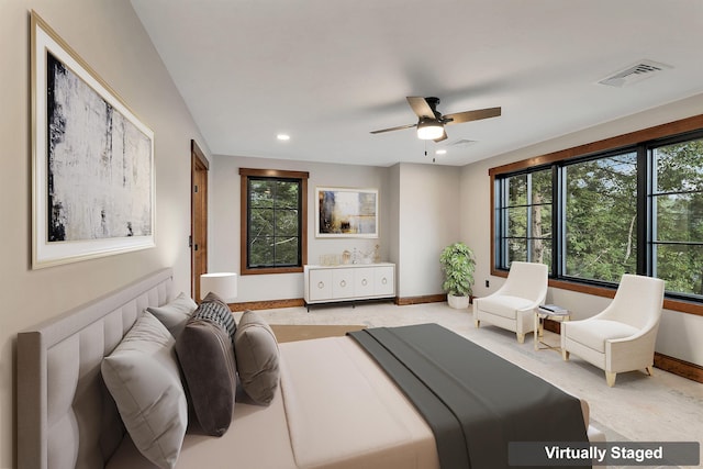 bedroom with light carpet and ceiling fan