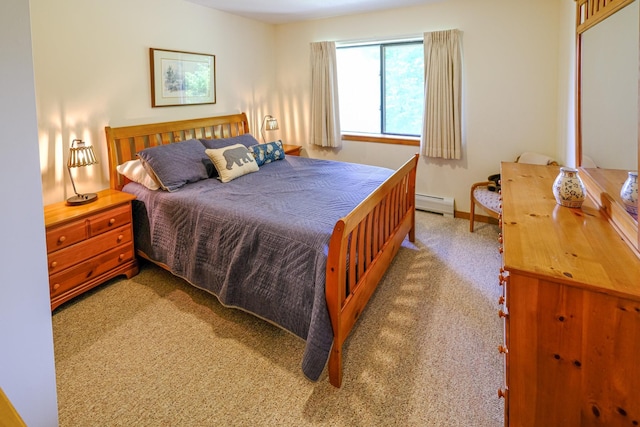 bedroom featuring carpet floors, baseboard heating, and baseboards