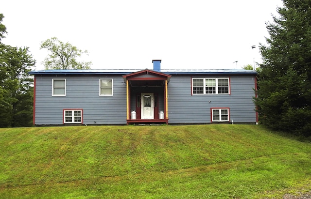 split foyer home with a front lawn