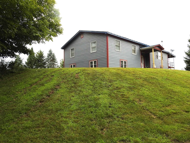 view of home's exterior featuring a yard