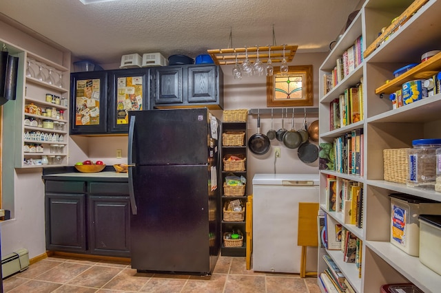 pantry featuring baseboard heating