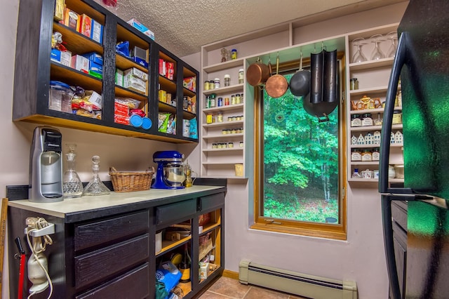 pantry featuring baseboard heating