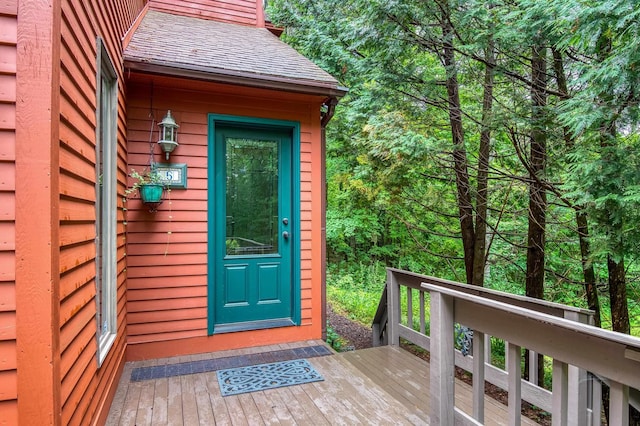 entrance to property with a wooden deck