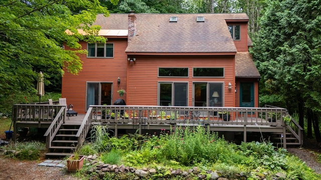 rear view of property with a deck