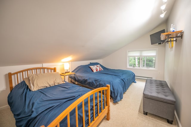 bedroom featuring carpet floors, a baseboard heating unit, and lofted ceiling