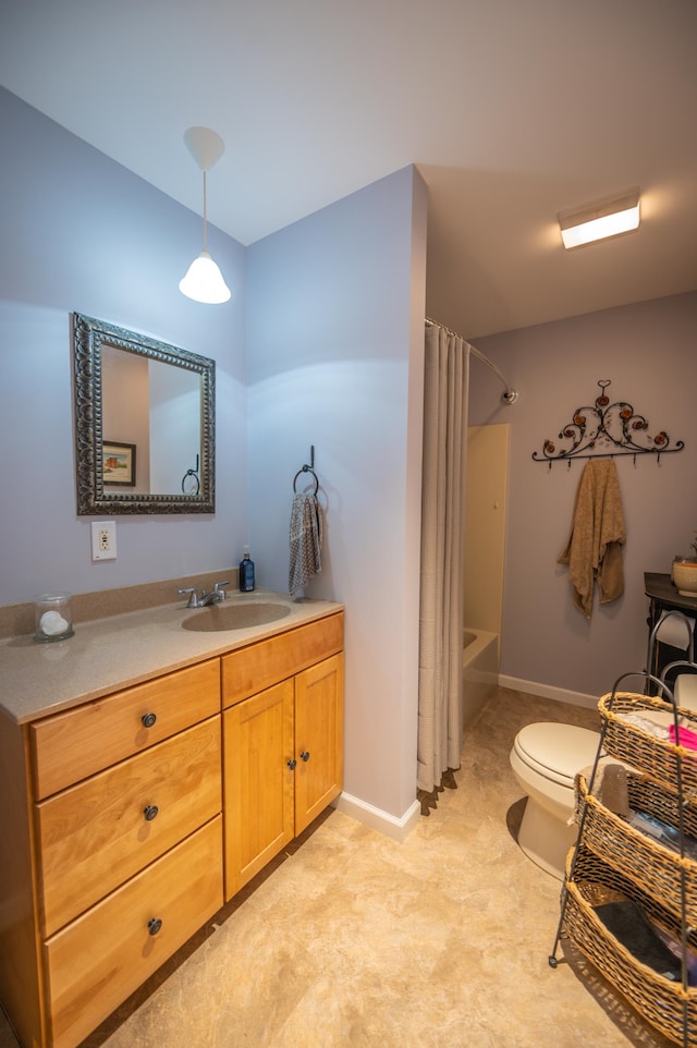 full bathroom with shower / bath combo with shower curtain, toilet, and vanity