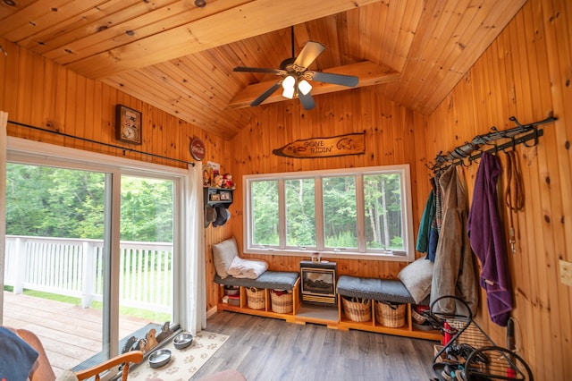 sunroom / solarium with vaulted ceiling with beams, wooden ceiling, and ceiling fan