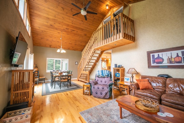 living room featuring high vaulted ceiling, ceiling fan with notable chandelier, wooden ceiling, and hardwood / wood-style flooring