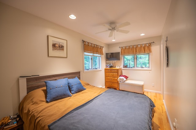 bedroom featuring light wood-type flooring and ceiling fan