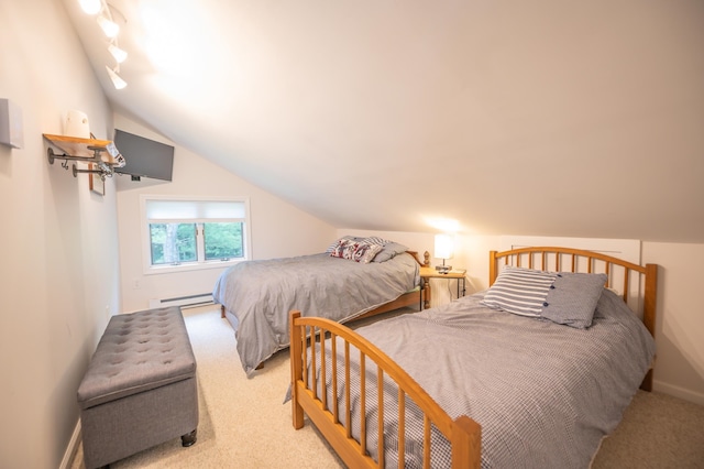 carpeted bedroom featuring rail lighting, a baseboard heating unit, and vaulted ceiling