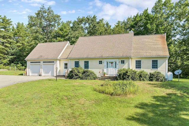 cape cod house with aphalt driveway, an attached garage, roof with shingles, a front lawn, and a chimney