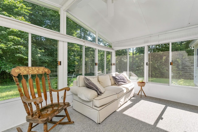 sunroom with lofted ceiling and plenty of natural light