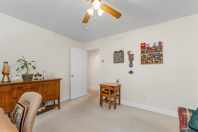 office with light colored carpet, ceiling fan, and baseboards