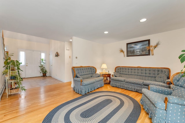 living room with wood finished floors and recessed lighting