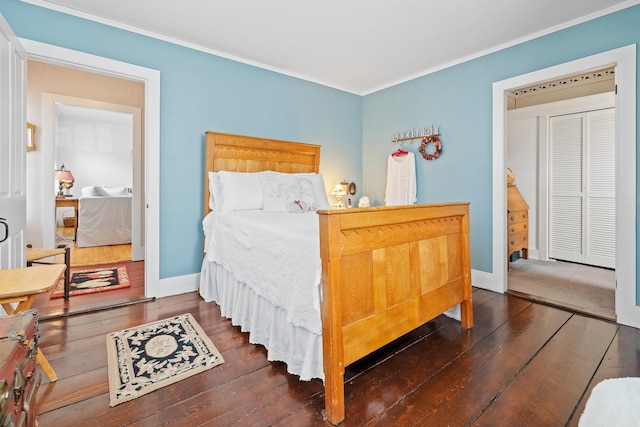 bedroom with ornamental molding and dark hardwood / wood-style flooring