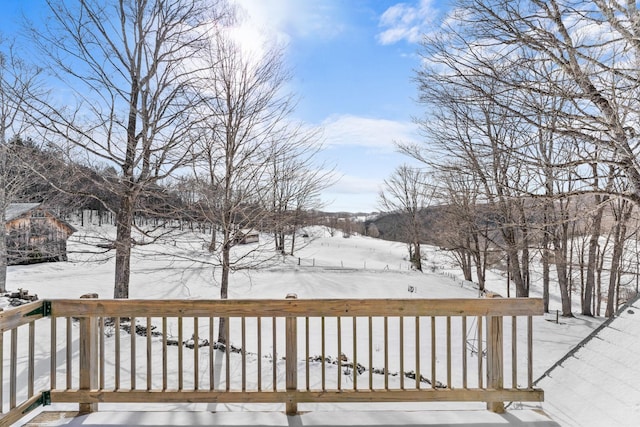 view of snow covered deck