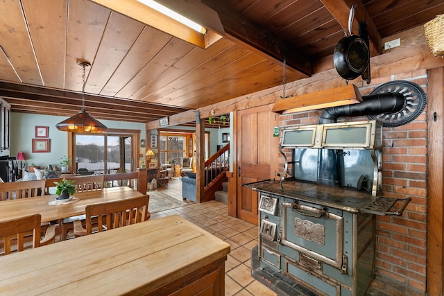 kitchen with light tile patterned floors, wood ceiling, and beamed ceiling