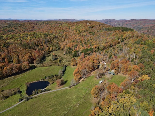 aerial view with a mountain view and a view of trees